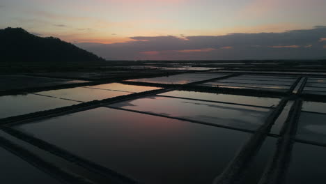 Salt-fields,-mirror-flat-reflections-of-sunset