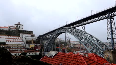 Panning-left-shot-of-Ponte-Dom-Luis-I-and-Mosteiro-da-Serra-do-Pilar,-Porto