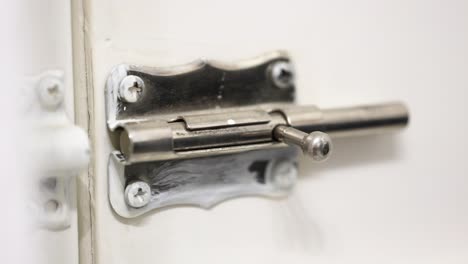 Locking-a-door-with-a-simple-latch-on-a-closer-view