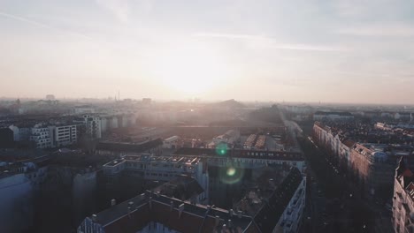 An-aerial-of-a-beautiful-sunset-over-the-roofs-of-Berlin-at-a-dreamy,-sunny-summer-day