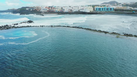 Flying-over-the-El-Puertillo-pools-in-the-municipality-of-Arucas-and-with-strong-waves