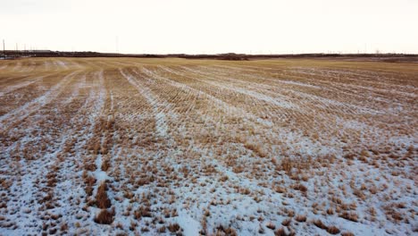 Empty-and-frozen-farmer's-field-in-the-middle-of-winter-in-Canada