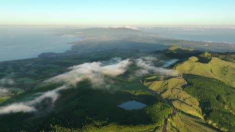 Low-clouds-float-over-verdure-volcanic-landscape-of-São-Miguel,-Azores