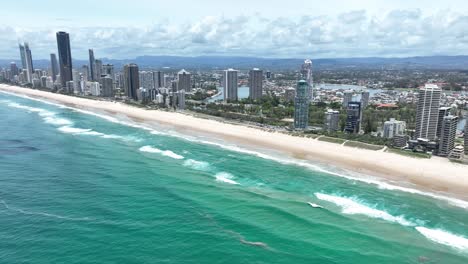 Surfers-Paradise,-Gold-Coast,-Queensland-Australia,-aerial-view-over-the-world-famous-beaches-of-this-iconic,-world-famous-travel-destination
