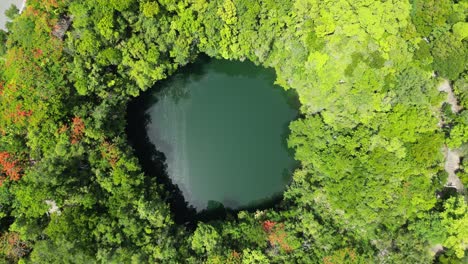 Aerial-view-revealing-one-of-the-lagoons-of-Los-Tres-Ojos-National-Park-in-Santo-Domingo-Este-in-the-Dominican-Republic