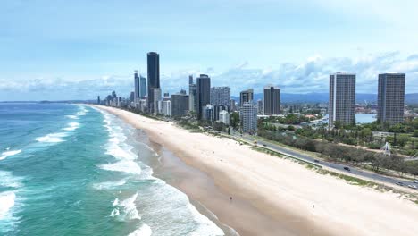Rolling-waves-crashing-onto-golden-beaches,-Surfers-Paradise-Australia,-Queensland’s-playground