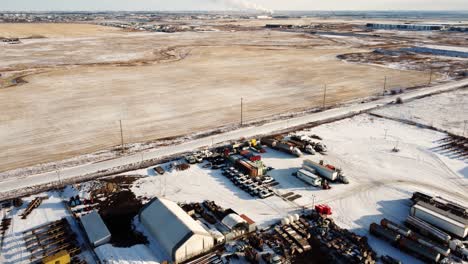 Aerial-revealing-shot-of-the-steaming-Shepard-Energy-Centre-in-Calgary-in-winter