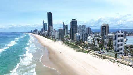 The-iconic-Gold-Coast-beach-front,-luxury-apartments-looking-out-over-the-golden-sands-of-Sufers-Paradise,-Queensland,-Australia