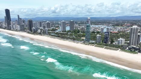 Surf-crashing-on-the-world-famous-beaches-of-Surfers-Paradise,-Gold-Coast,-Queensland-Australia,-stunning-views,-golden-sands