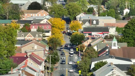 Small-town-USA-bustling-main-street-lined-with-colorful-fall-foliage