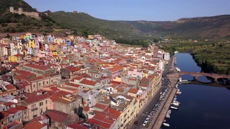 Bosa,-Sardinia,-Italy---Drone-aerial-shot-of-the-colourful-town-of-Bosa-in-Sardinia