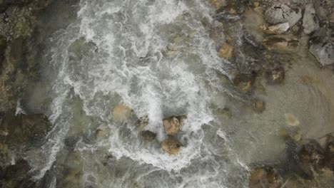 Floating-Water-in-Scharnitz,-Austria-from-above-in-Slow-Motion