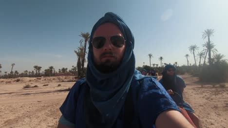 traveler-goes-on-a-camel-ride-in-the-desert---Marrakesh---Morocco