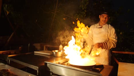 A-chef-making-food-in-an-outdoor-kitchen-at-a-restaurant-in-Goa