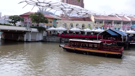 A-passenger-boat-sailing-pass-Clarke-Quay-for-sightseeing