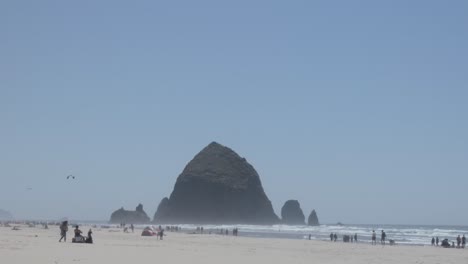 People-around-Haystack-Rock-at-Cannon-Beach-Oregon-USA