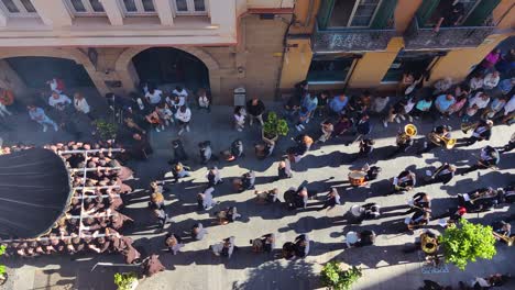 Top-down-view-of-a-marching-band-parading-through-Malaga-during-Semana-Santa-Holy-Week