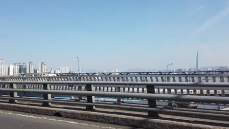 POV-crossing-a-river-bridge-by-car