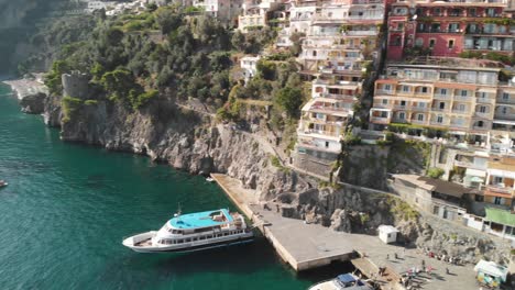 Positano,-Amalfi-Coast---aerial-descending-pan-over-the-colorful-buildings-of-the-old-town