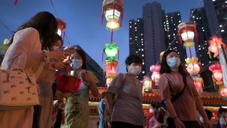 Visitors-are-seen-at-a-lantern-show,-which-symbolizes-prosperity-and-good-fortune,-at-a-temple-to-celebrate-the-Mid-Autumn-Festival,-also-called-Mooncake-Festival
