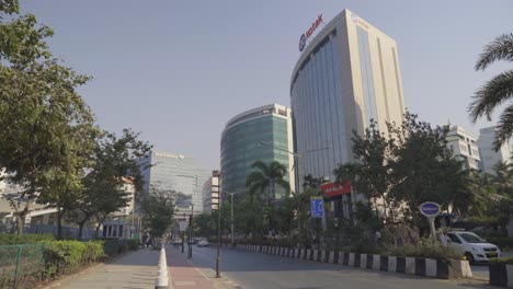 Smart-city-street-pavement,-smooth-traffic-movement-across-the-street-of-Kotak-Mahindra-bank-branch-office-building-at-Bandra-Kurla-Complex
