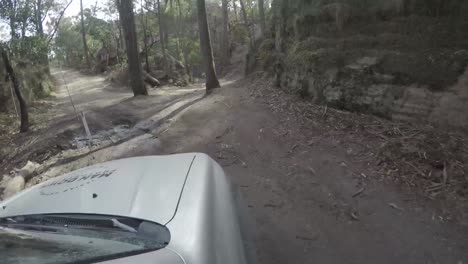 A-young-man-on-a-road-trip-in-his-4x4-traveling-on-a-dirt-road-and-4wd-track-in-Newnes-Lithgow