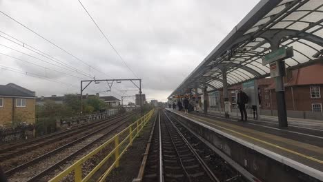 Timelapse-of-London-DLR-front-seat-towards-City-of-London-in-Canary-Wharf-in-a-cloudy-day