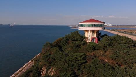 Pedestal-landing-aerial-shot-of-coastal-sightseeing-tower
