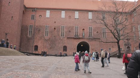 People-Walking-In-The-Inner-Courtyard-Of-Stockholm-City-Hall-In-Sweden