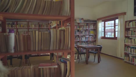 The-camera-enters-a-humble-village-library