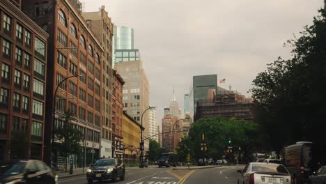 Pov-drive-on-road-of-New-York-during-cloudy-day-with-Empire-State-Building-in-background---Slow-motion