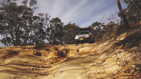 A-young-man-on-a-road-trip-in-his-4x4-traveling-on-a-dirt-road-and-4wd-track-in-Newnes-Lithgow
