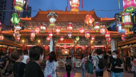 Visitors-and-travelers-attend-and-take-photos-during-a-lantern-show,-which-symbolizes-prosperity-and-good-fortune,-at-a-temple-to-celebrate-the-Mid-Autumn-Festival,-also-called-Mooncake-Festival