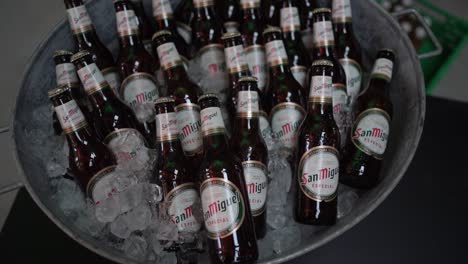 slow-motion-clip-of-cold-beer-bottles-in-metal-tub-filled-with-ice
