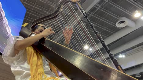 slow-motion-shot-of-maya-artist-playing-harp