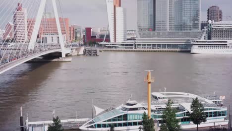 Beautiful-timelapse-in-the-heart-of-Rotterdam-with-view-of-the-Erasmusbrug,-NHow-Hotel-and-the-Spido-ferry