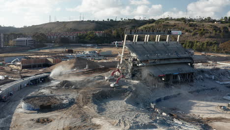 Pan-of-excavators-demolishing-Qualcomm-stadium-in-San-Diego