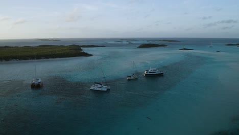 Luxury-Yacht,-Sailboat,---Catamaran-on-Bahamas-Island-Tour-Adventure,-Aerial