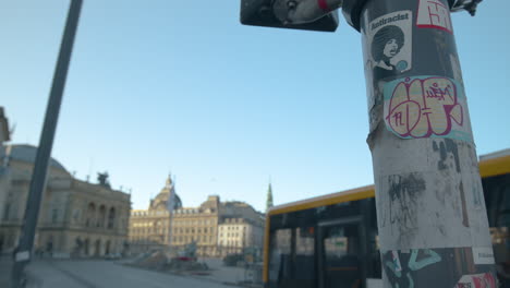 Bus-drives-past-lamp-post-on-early-morning-in-Copenhagen,-Denmark