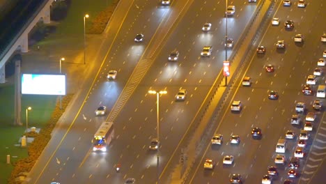 Cars-Rushing-Through-Highway-Of-Sheikh-Zayed-Road-In-The-Evening---aerial-shot