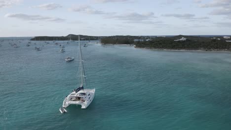 Sailboat-on-Nautical-Adventure-on-the-Seas-in-the-Bahamas,-Aerial-Circling
