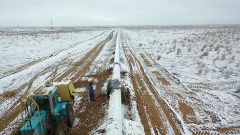 Drone-shot-of-newly-constructed-gas-and-oil-pipeline-in-winter