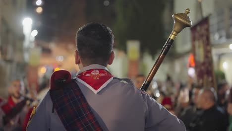 Marshal-in-military-band-raises-baton-in-Easter-night-parade,-Nazareth