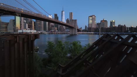 An-aerial-view-of-the-NYC-skyline-and-the-"LAND"-sculpture-in-Brooklyn-Bridge-Park-in-the-morning