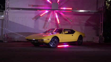 Classic-yellow-Lamborghini-with-colorful-neon-lights-flashing,-indoor