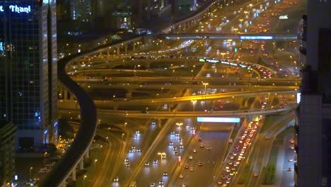 Scene-At-The-Sheikh-Zayed-Road-With-Cars-Travelling-At-Night-In-Dubai,-United-Arab-Emirates