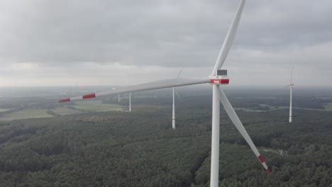 An-Orbit-drone-shot-of-a-wind-turbine-with-more-in-the-background