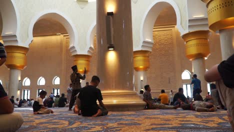 The-Muslims-are-in-the-mosque-with-a-beautiful-interior-and-golden-pillars