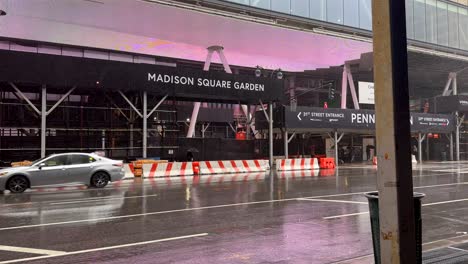 Heavy-Rain-Outside-Madison-Square-Garden-in-New-York-With-Car-Driving-Past-In-New-York
