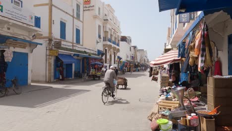 People-on-street-in-Medina-quarters-of-Essaouira,-Morocco,-static-shot